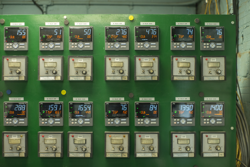 A control panel that monitors each kiln on the property shows the temperature and status of each kiln. 