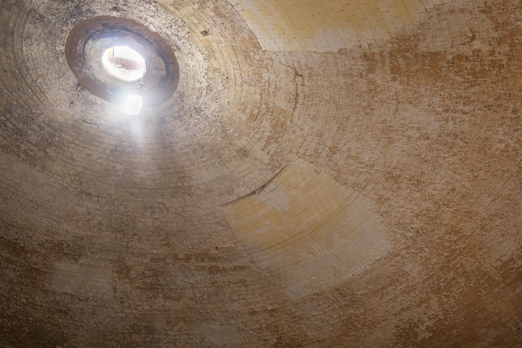 The domed roof of a beehive kiln encourages hot air to circulate evenly around the pieces.